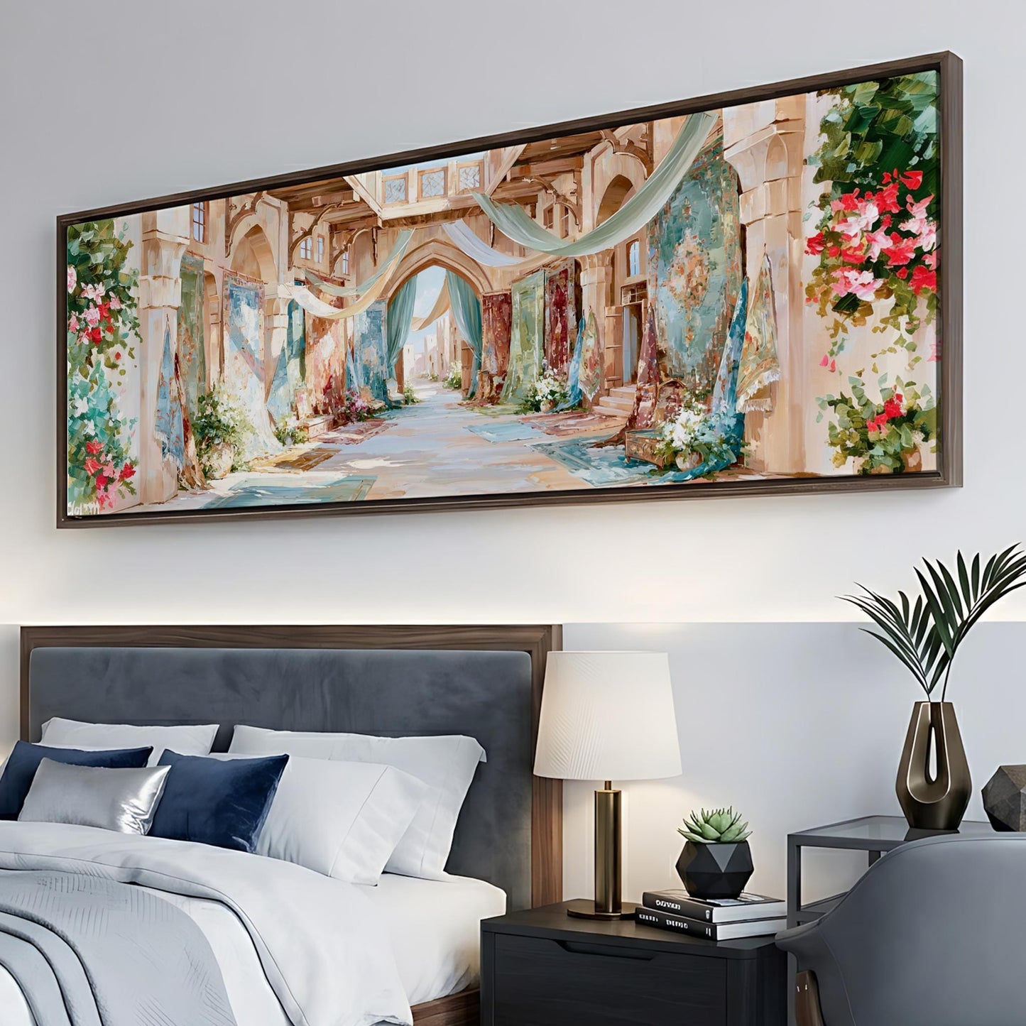 a large, colorful painting of a street scene hanging on a wall above a bed with white bedding and blue pillows.