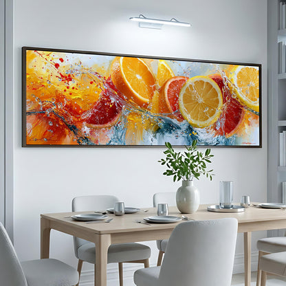a large, colorful painting of oranges and lemons hanging on a white wall above a dining table with white chairs.