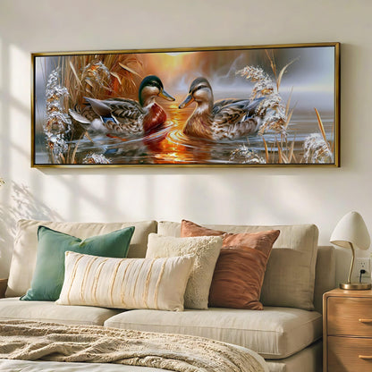 a large painting of two ducks swimming in a pond, hanging on a wall above a couch with pillows.
