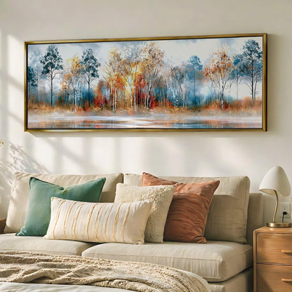 a large painting of a forest scene hanging on a wall above a beige sofa with colorful throw pillows.