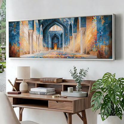 a large painting of an ornate, colorful archway with intricate details, hanging on a wall above a wooden desk with various items on it.