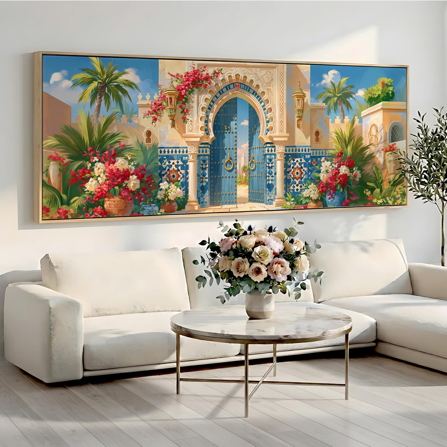 a large, colorful painting of an ornate gate and lush tropical foliage hanging on a wall above a white sofa and a round coffee table.