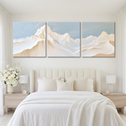 A serene bedroom with a large bed, white bedding, and a large painting of a mountain landscape above it.