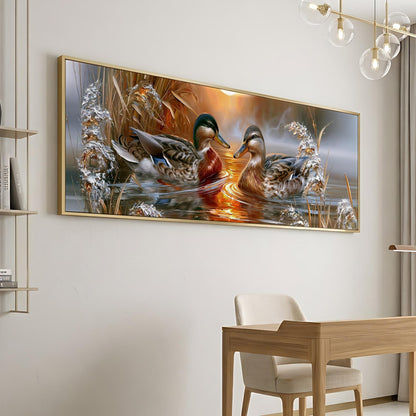 a large framed painting of two ducks swimming in a pond, surrounded by a serene and natural environment.