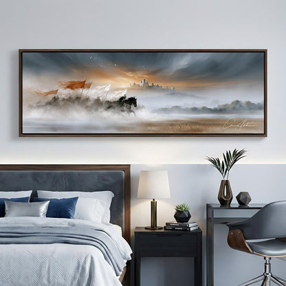 a large, framed painting of a serene landscape hanging on a wall above a bed with a gray headboard. The painting depicts a misty, foggy scene with a castle in the distance, surrounded by trees and mountains. The room also includes a nightstand with a lamp, a chair, and a plant, creating a cozy and inviting atmosphere.