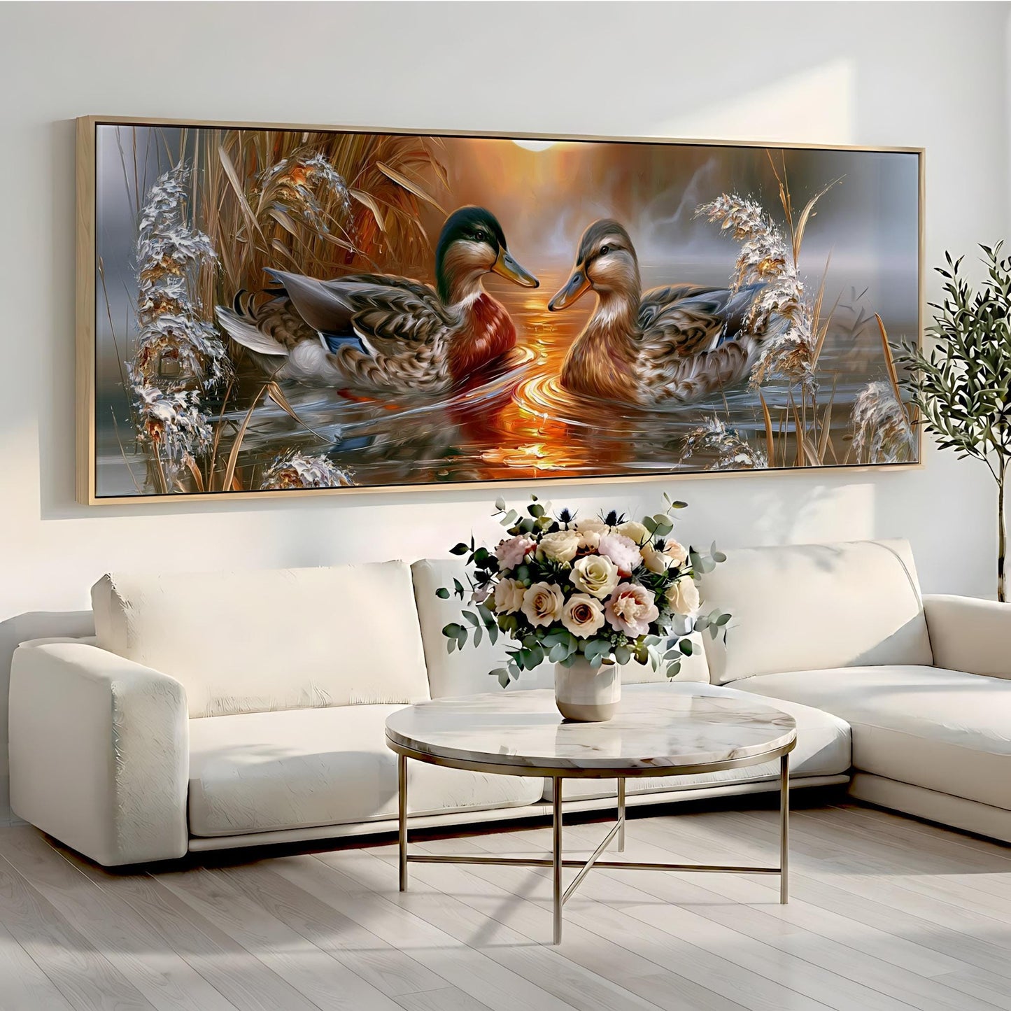 a large painting of two ducks swimming in a pond, with a vase of flowers on a table in front of the painting.