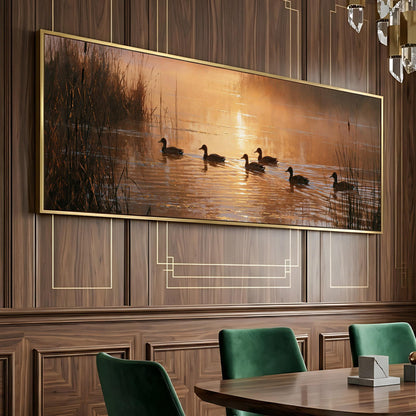 a large painting of ducks swimming on a lake, with a warm sunset in the background.