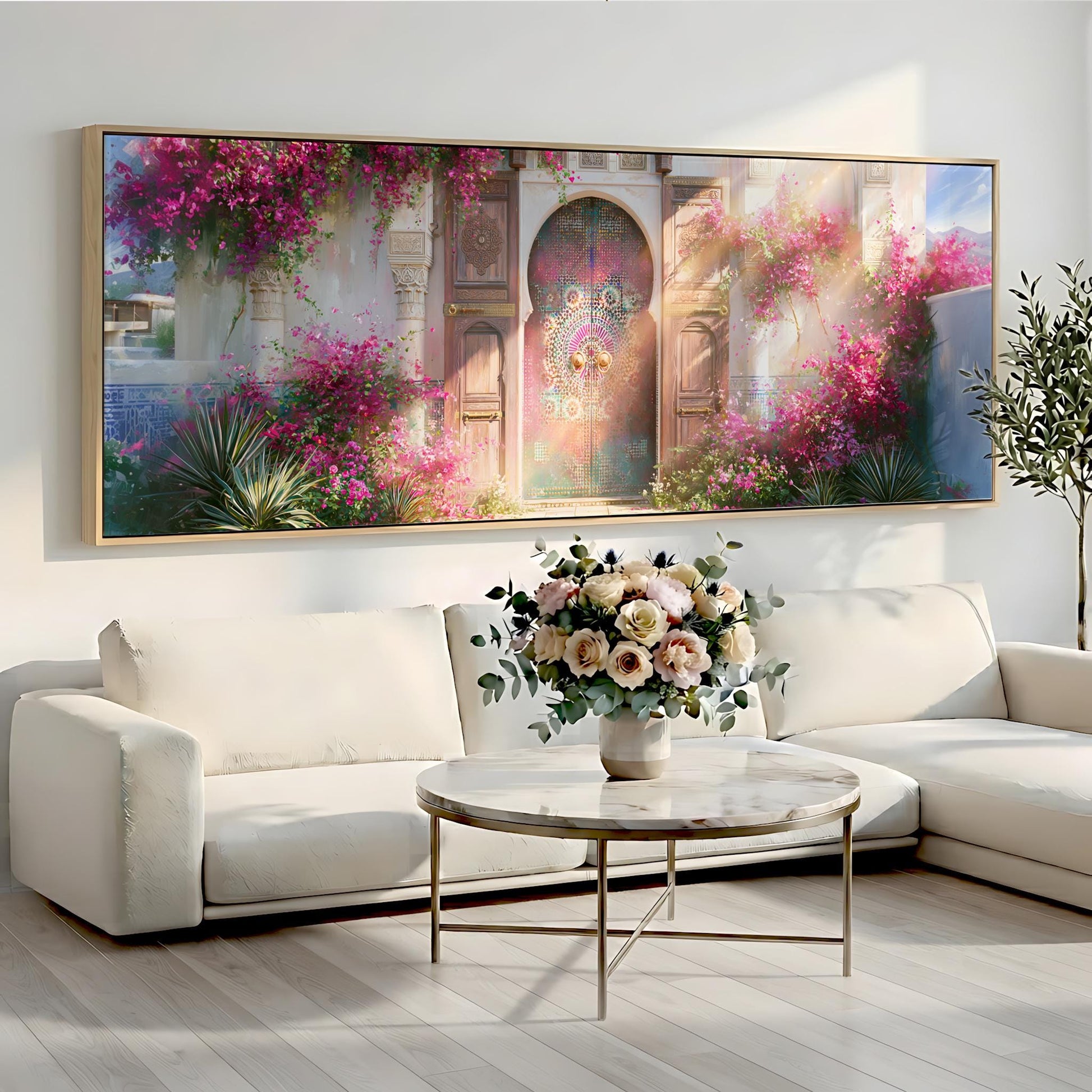 a large, colorful painting of a garden with pink flowers and a wooden door, hanging on a wall above a white sofa and a round coffee table.