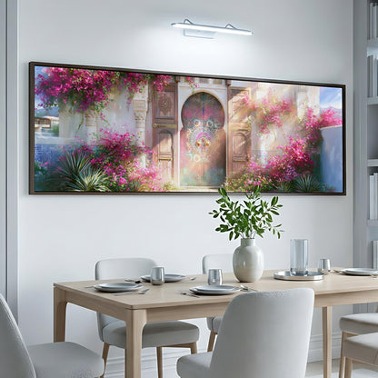 a dining room with a large, colorful painting of a garden hanging on the wall above a table set for a meal.