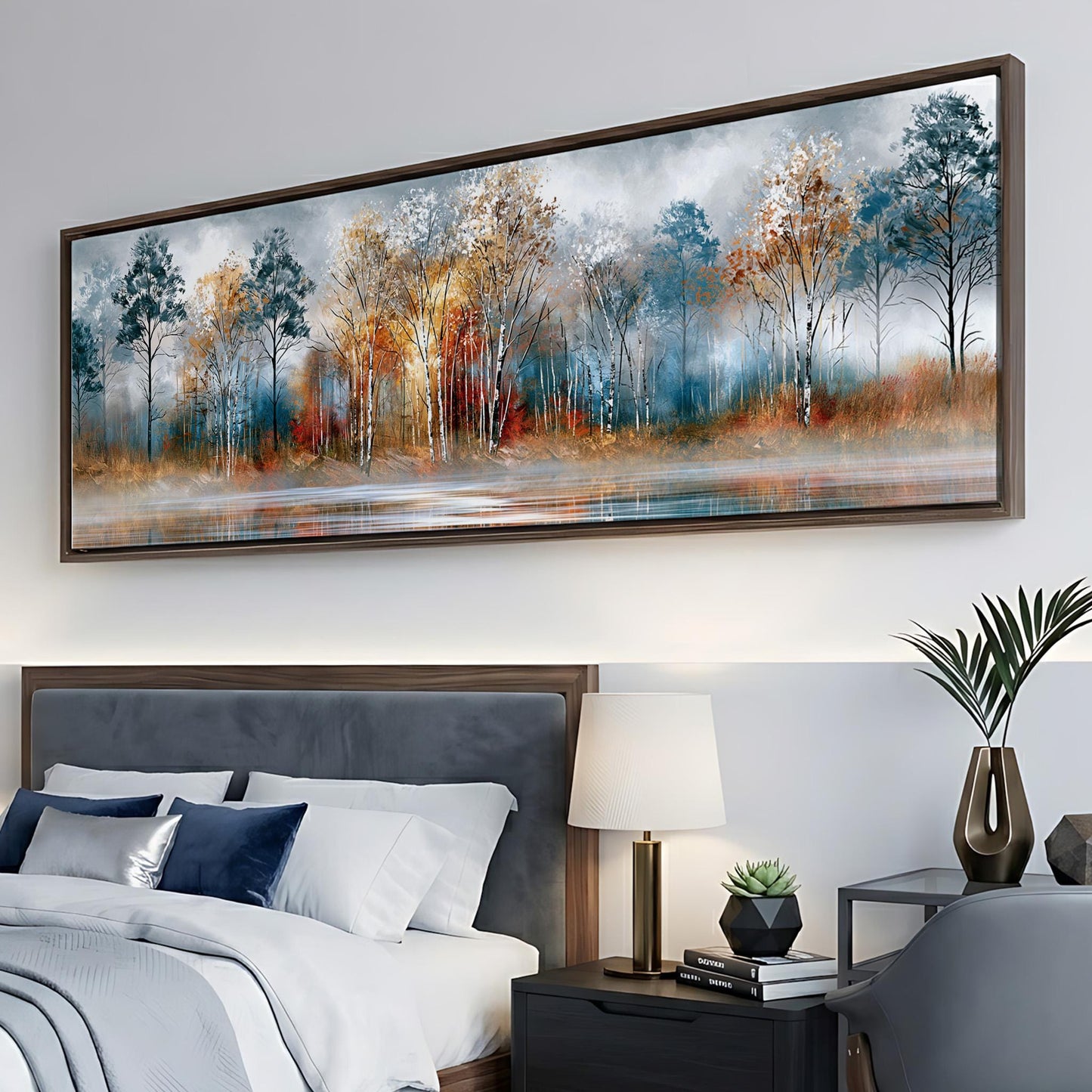 a large painting of a forest landscape hanging on a wall above a bed with white bedding and a gray headboard.