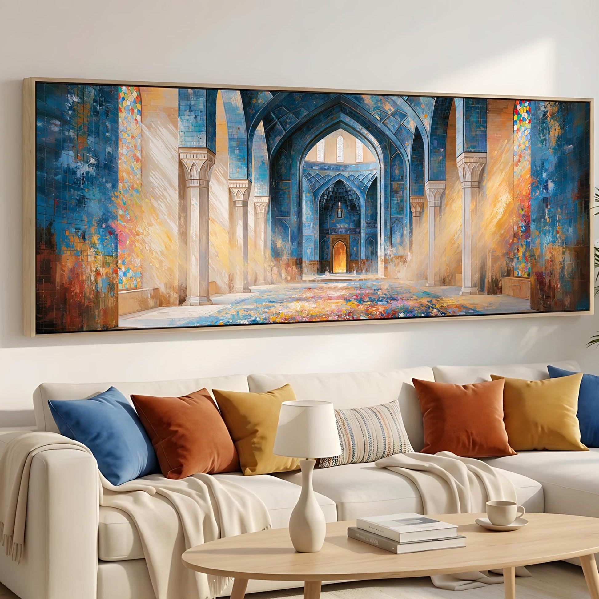 a large, colorful painting of an ornate, blue-tiled interior with arched doorways and columns, hanging on a wall above a white sofa with colorful throw pillows.