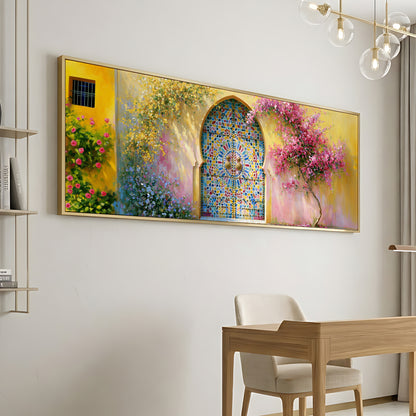 a large, colorful painting of a stained glass window with a vibrant floral design, hanging on a white wall above a wooden desk and chair in a modern, minimalist room.