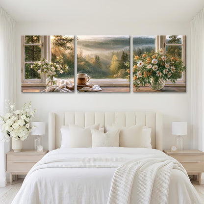 The image is a large, three-panel artwork depicting a serene bedroom scene with a bed, nightstands, and a vase of flowers. The panels show a sunrise or sunset view through the windows, with the warm colors of the sky and the flowers creating a peaceful and inviting atmosphere.