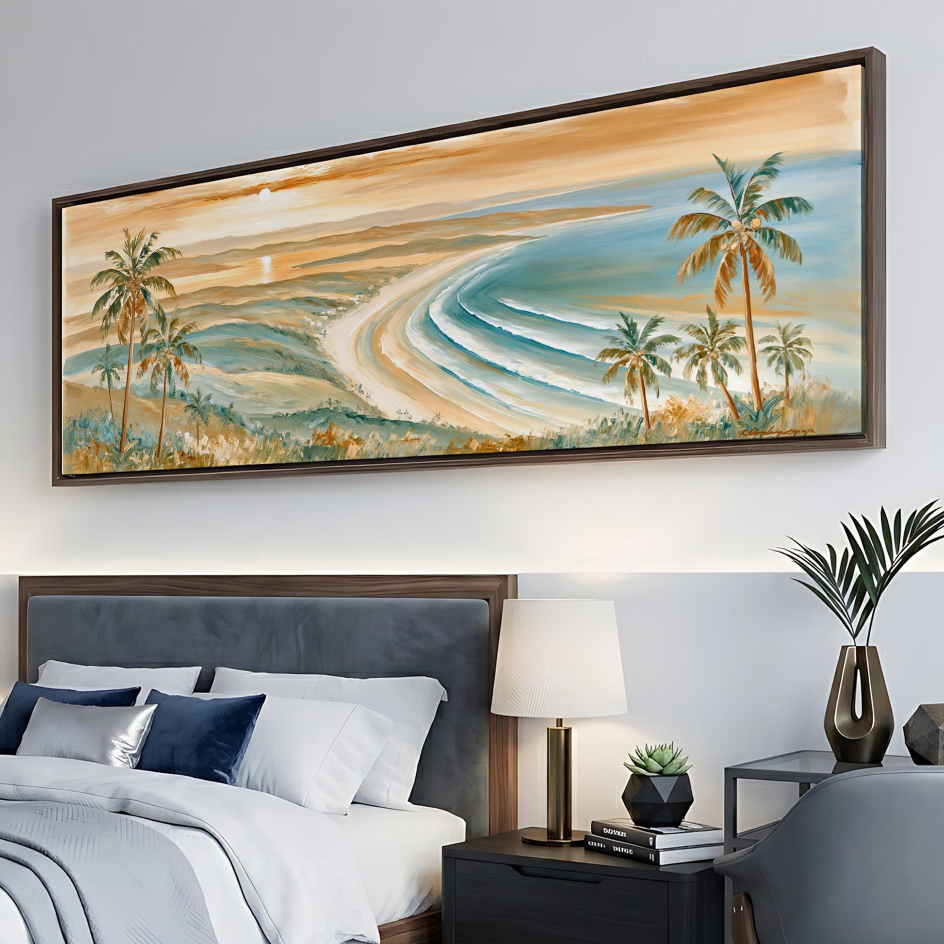 a large painting of a tropical beach scene hanging on a wall above a bed with white linens and blue pillows.
