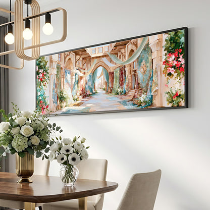 a large, colorful painting of an ornate, historic-looking building with arches and columns, hanging on a wall above a dining table with a vase of white flowers.