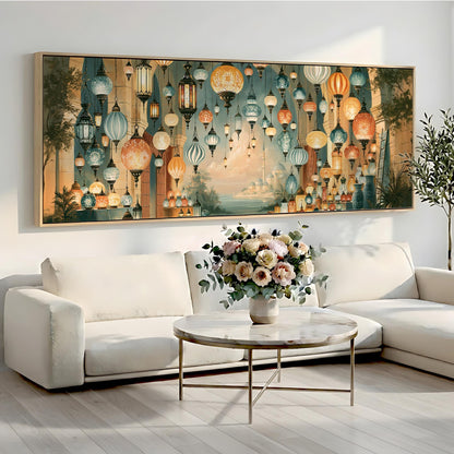 a large, colorful painting of hanging lanterns on a wall above a white sofa and a round coffee table with a vase of flowers.
