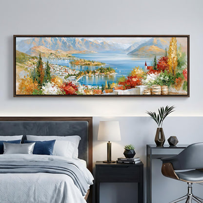a large, colorful painting of a scenic landscape hanging on a wall above a bed in a bedroom setting.