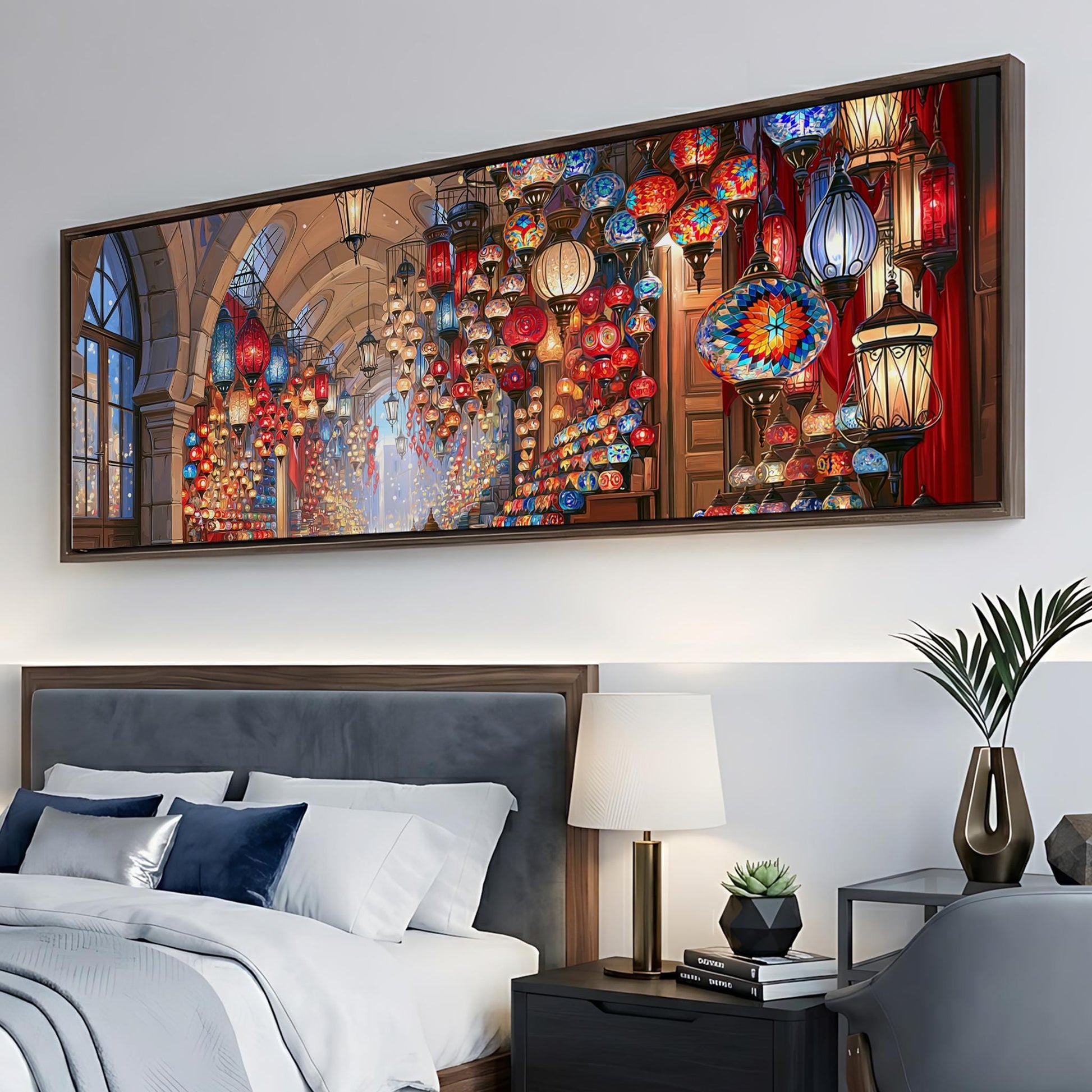 a large, colorful painting of a lantern-filled room hanging on a wall above a bed.
