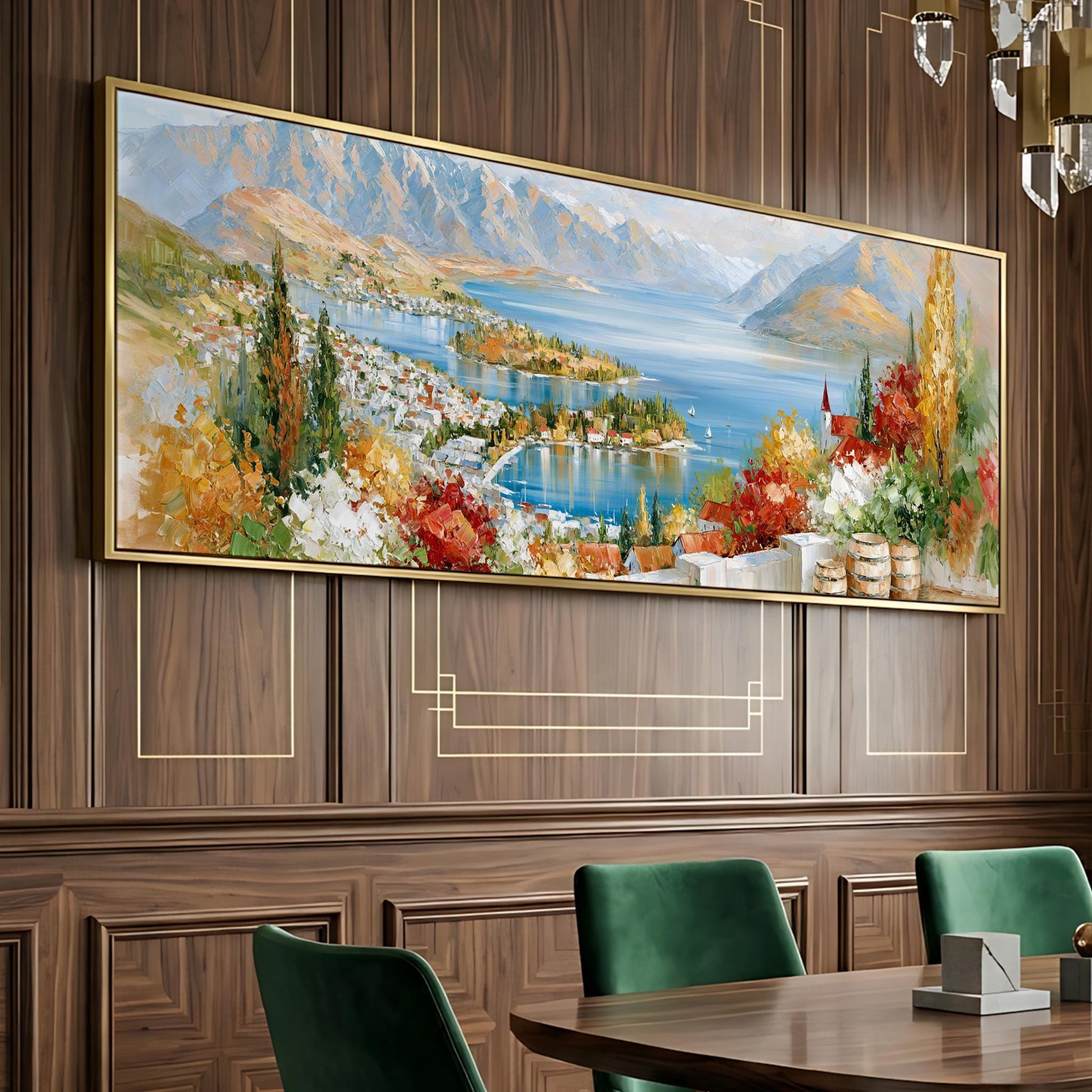 a large, colorful painting of a scenic landscape hanging on a wooden wall above a dining table with green chairs.