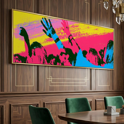 a large, colorful painting of a group of people with raised arms, displayed on a wooden wall above a wooden dining table with green chairs.