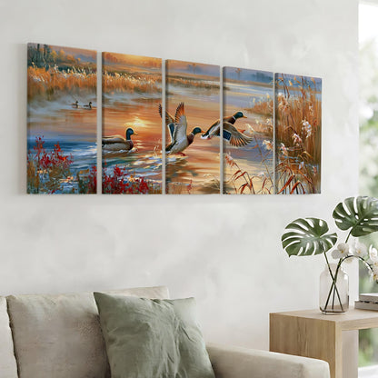 a large, colorful painting of ducks in a pond, with a warm sunset in the background. The painting is divided into five panels, each depicting a different stage of the ducks' flight. The painting is hung on a wall above a couch, creating a serene and natural atmosphere in the living room.