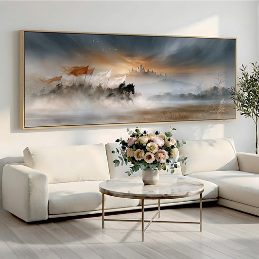 a large painting of a landscape with a castle in the background, hanging on a wall above a white sofa and a round coffee table with a vase of flowers.