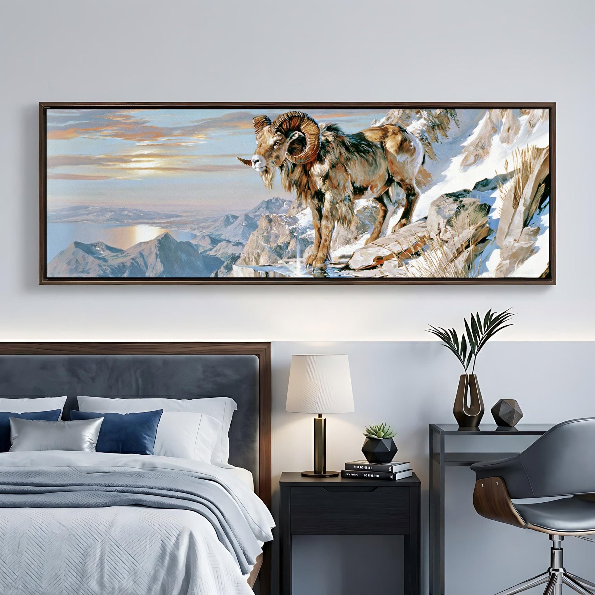 a large painting of a ram on a mountain, hanging on a wall above a bed with a gray headboard.