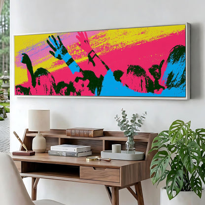 a large, colorful painting of a crowd of people with raised arms, displayed on a wall above a wooden desk with various items on it.