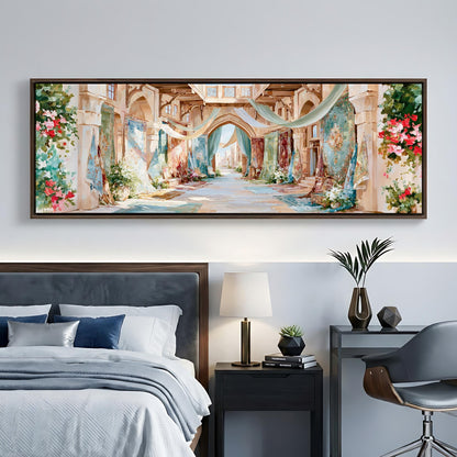 a large, colorful painting of an ornate, arched hallway with floral decorations hanging from the ceiling. The painting is displayed on a wall above a bed with a gray headboard. The room also includes a nightstand with a lamp, a chair, and a small table with decorative items.