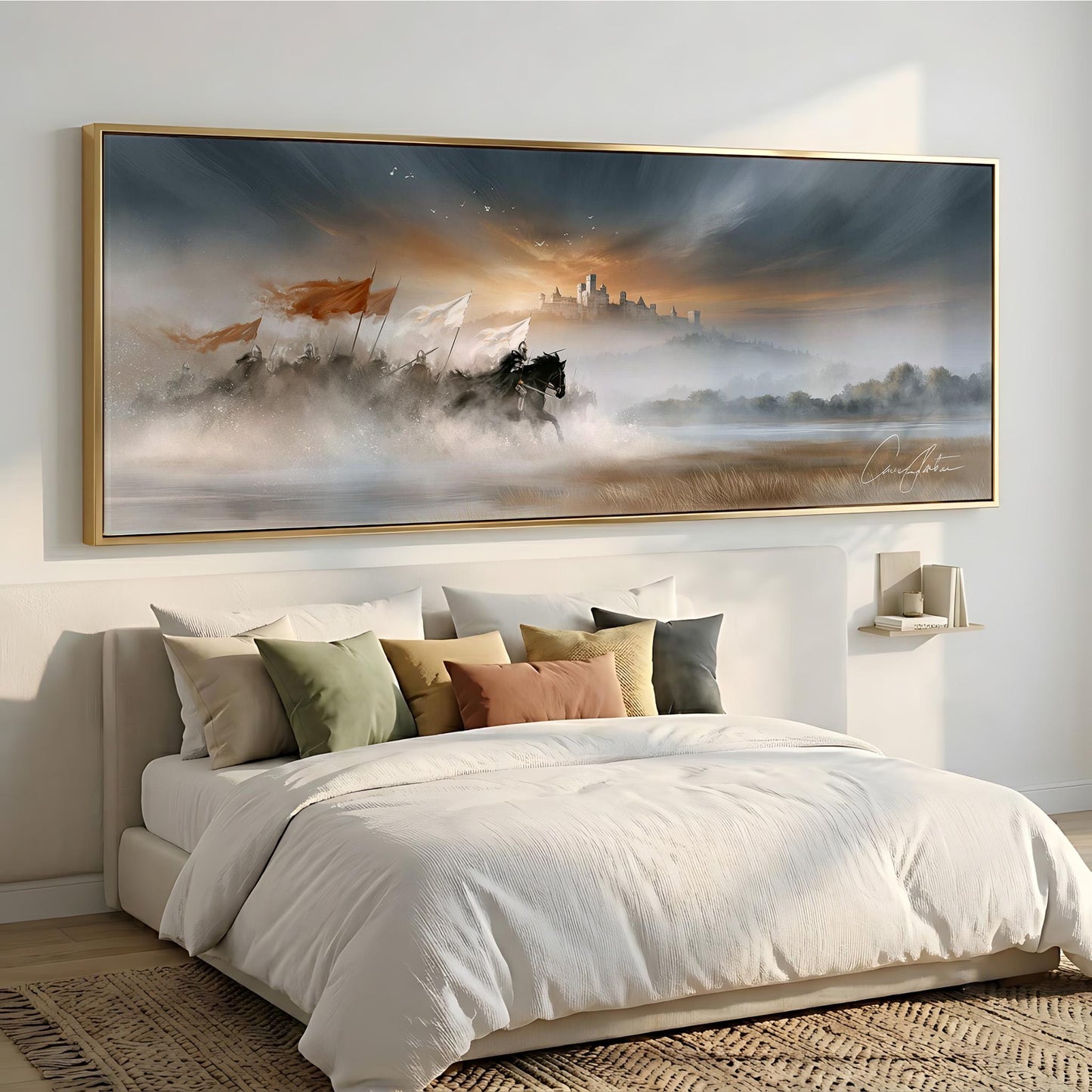 a large, framed painting of a serene landscape hanging above a bed with white bedding and colorful throw pillows.