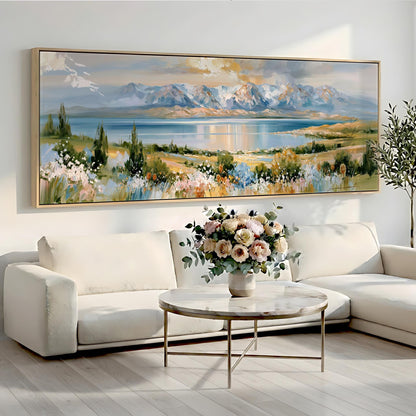 a large landscape painting hanging on a wall above a white sofa and a round coffee table with a vase of flowers.