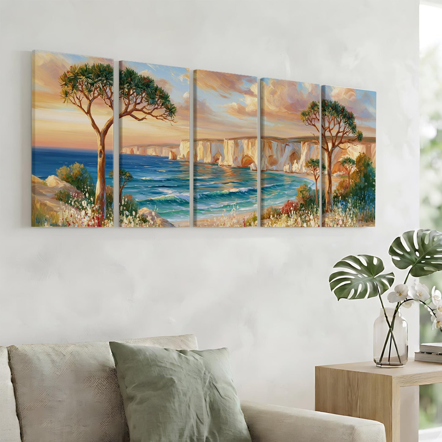 a large, colorful painting of a scenic landscape with a beach, ocean, and trees, hanging on a wall above a couch in a living room.