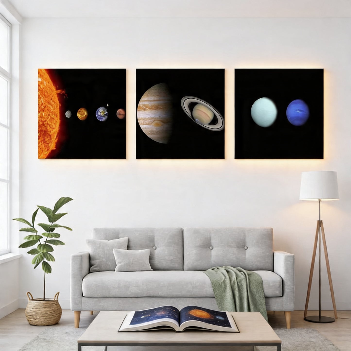 a modern living room with a gray sofa, a coffee table, and a potted plant. Above the sofa, there are three framed images depicting different planets in the solar system.