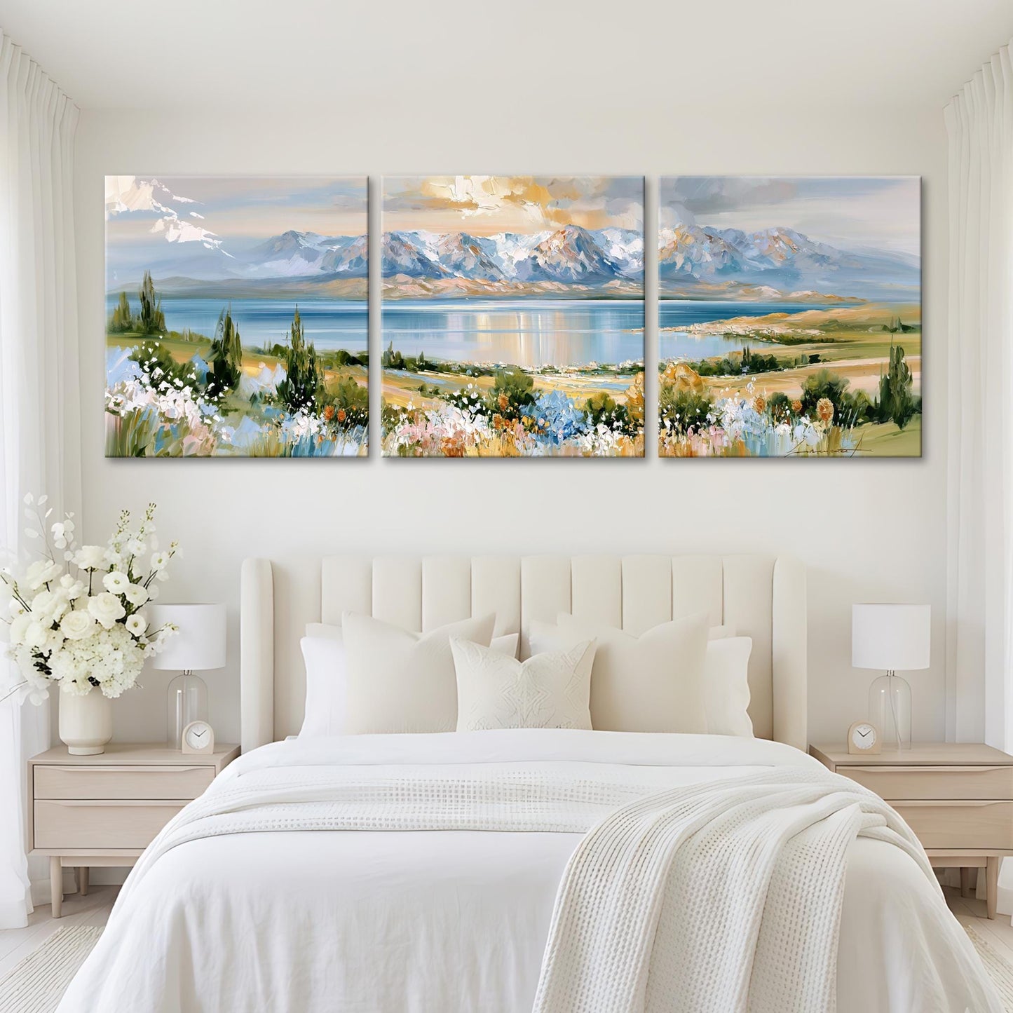 A large, three-panel landscape painting depicting a serene mountain scene with a lake and colorful flowers in the foreground.