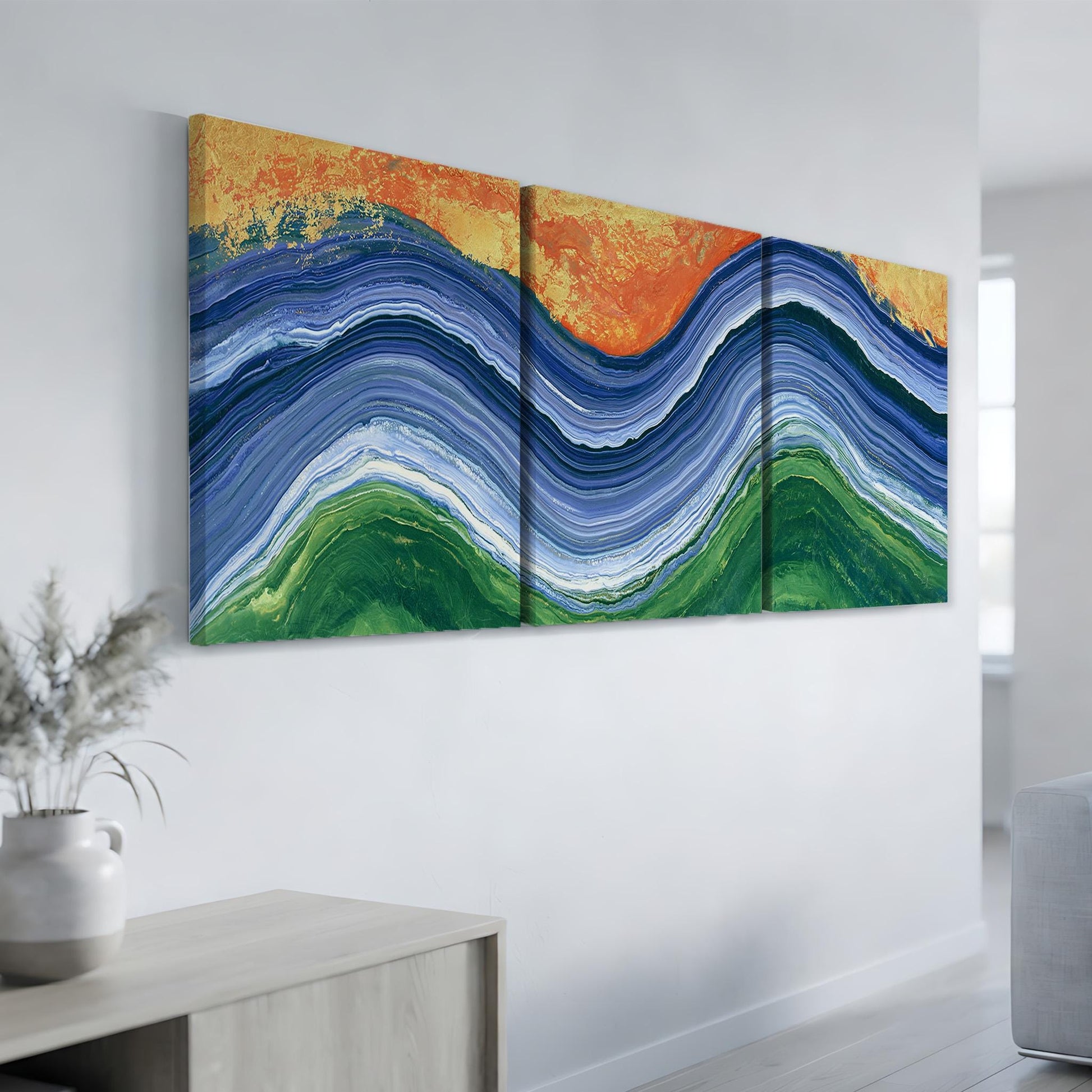 a large, colorful abstract painting hanging on a white wall.