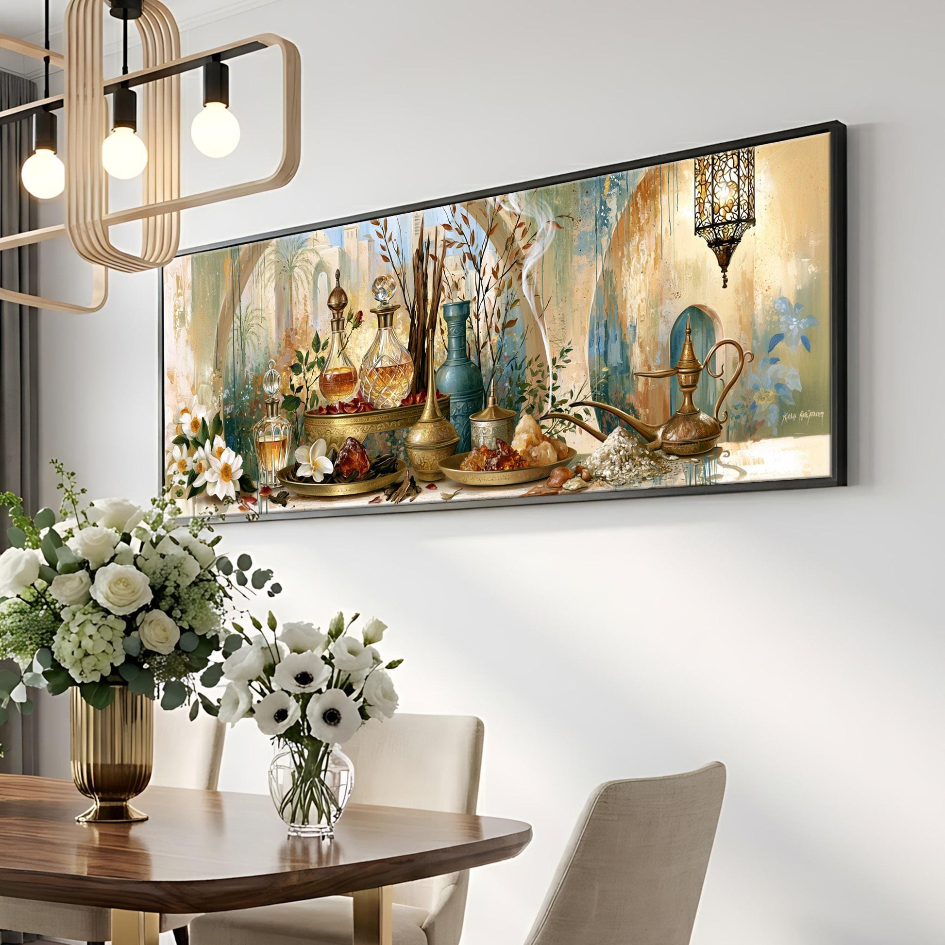 a dining room with a large painting of various vases, flowers, and other decorative items hanging on the wall above a wooden table. The table is set with a vase of white flowers and a glass vase containing white flowers. The room has a modern and elegant design, with a chandelier hanging from the ceiling and a pendant light fixture above the table.