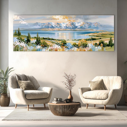 a large landscape painting hanging on a wall, depicting a serene mountain range and a lake. In the foreground, there are two white armchairs and a wooden coffee table, creating a cozy and inviting seating area.