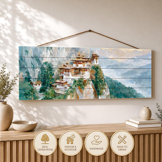 a wooden wall hanging depicting a picturesque mountain village with traditional architecture, surrounded by lush greenery.