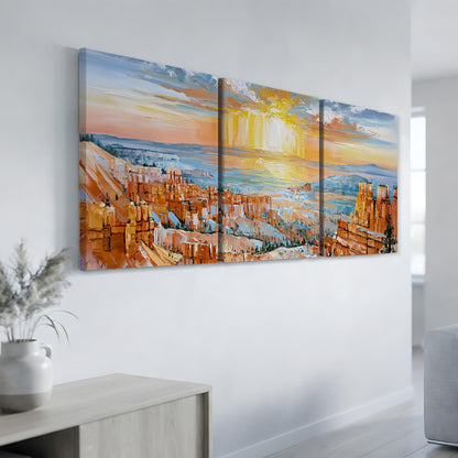 a large, colorful painting of a scenic landscape with mountains, buildings, and a sunset over the horizon.