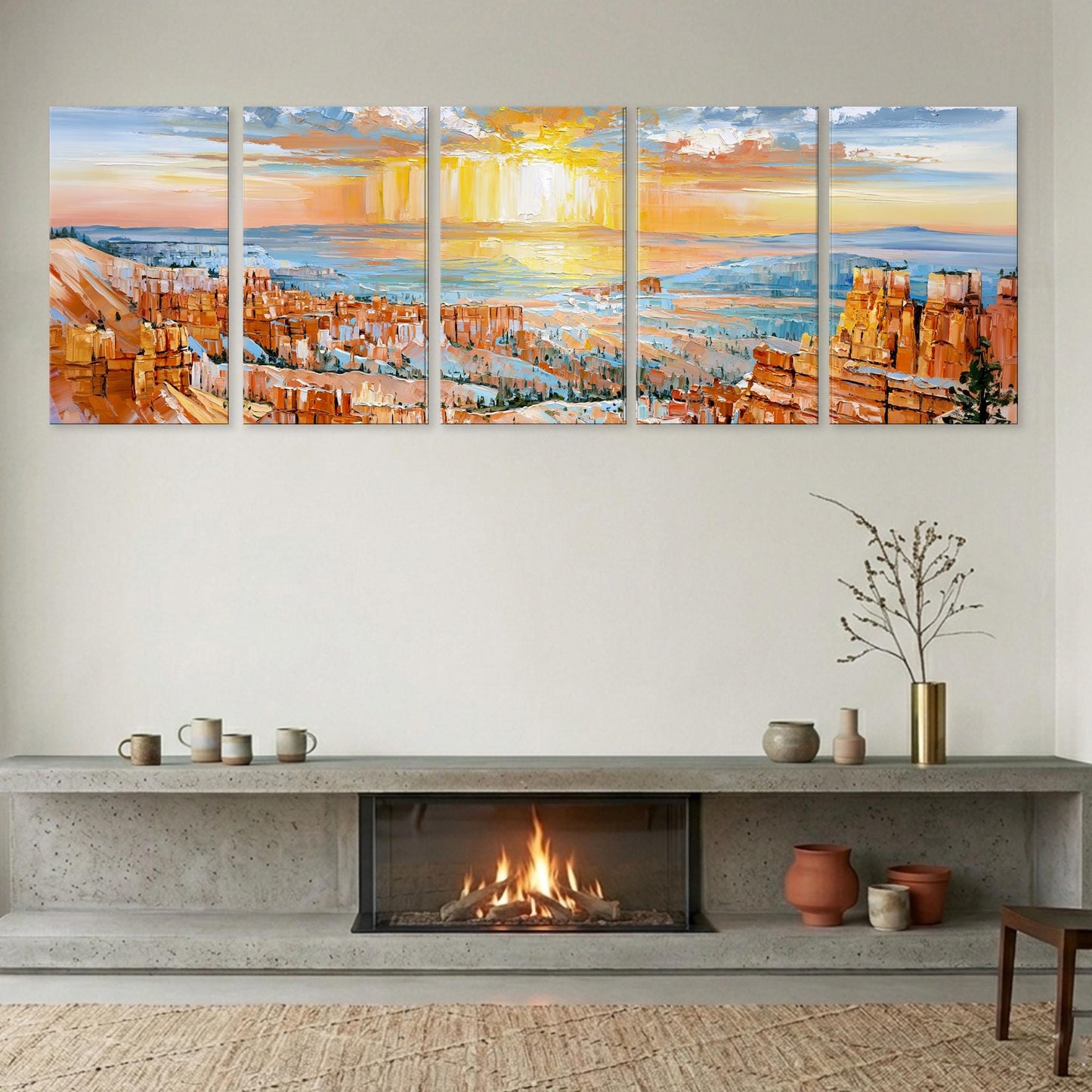 a cozy living room with a fireplace, a large wall art depicting a scenic landscape, and various decorative items on a shelf below the fireplace.