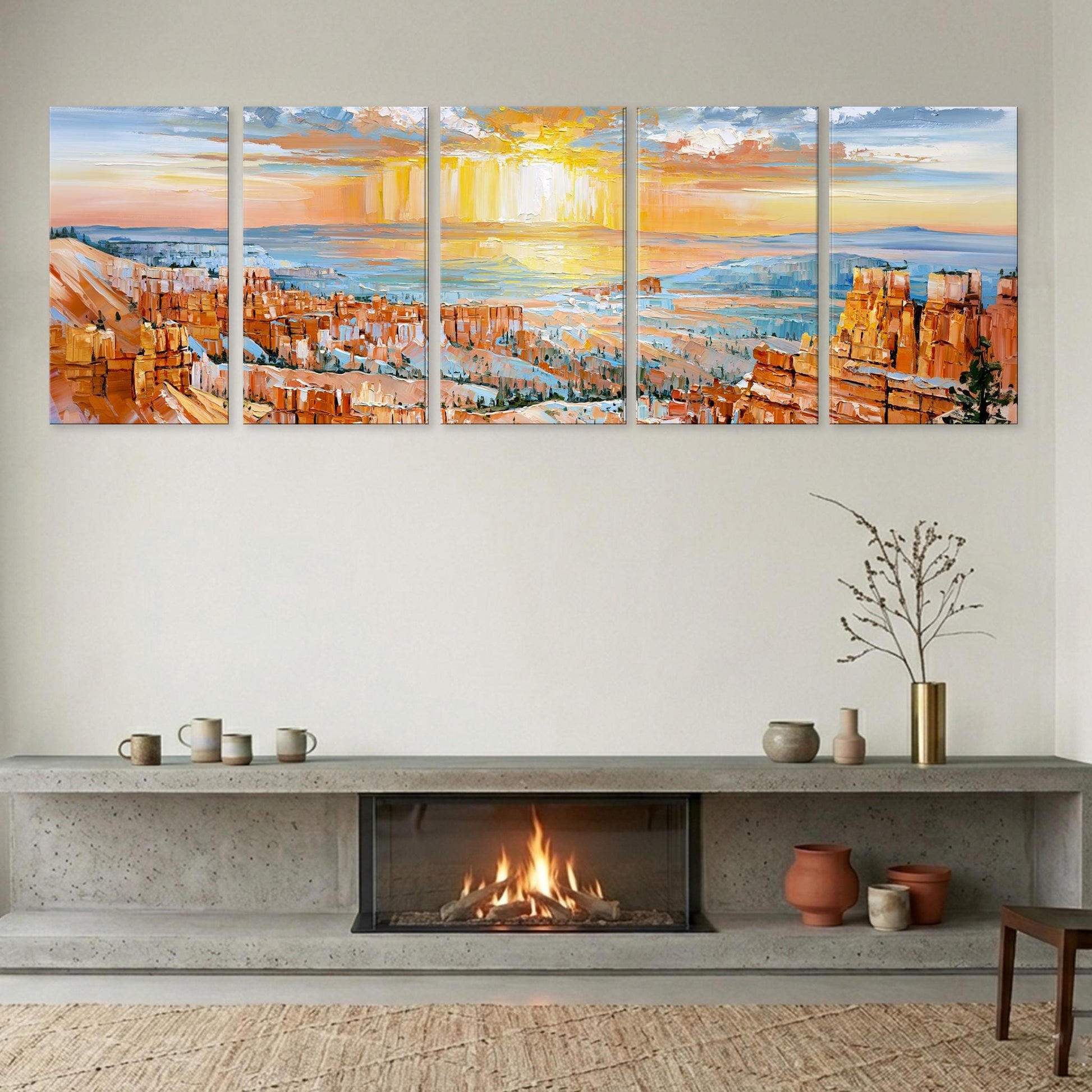 a cozy living room with a fireplace, a large wall art depicting a scenic landscape, and various decorative items on a shelf below the fireplace.