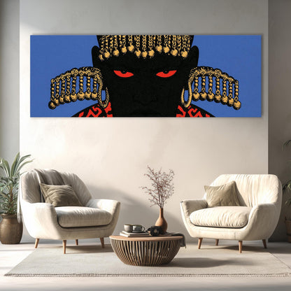 a large, colorful painting of a black face with gold accents hanging on a wall above a living room with two white armchairs and a coffee table.