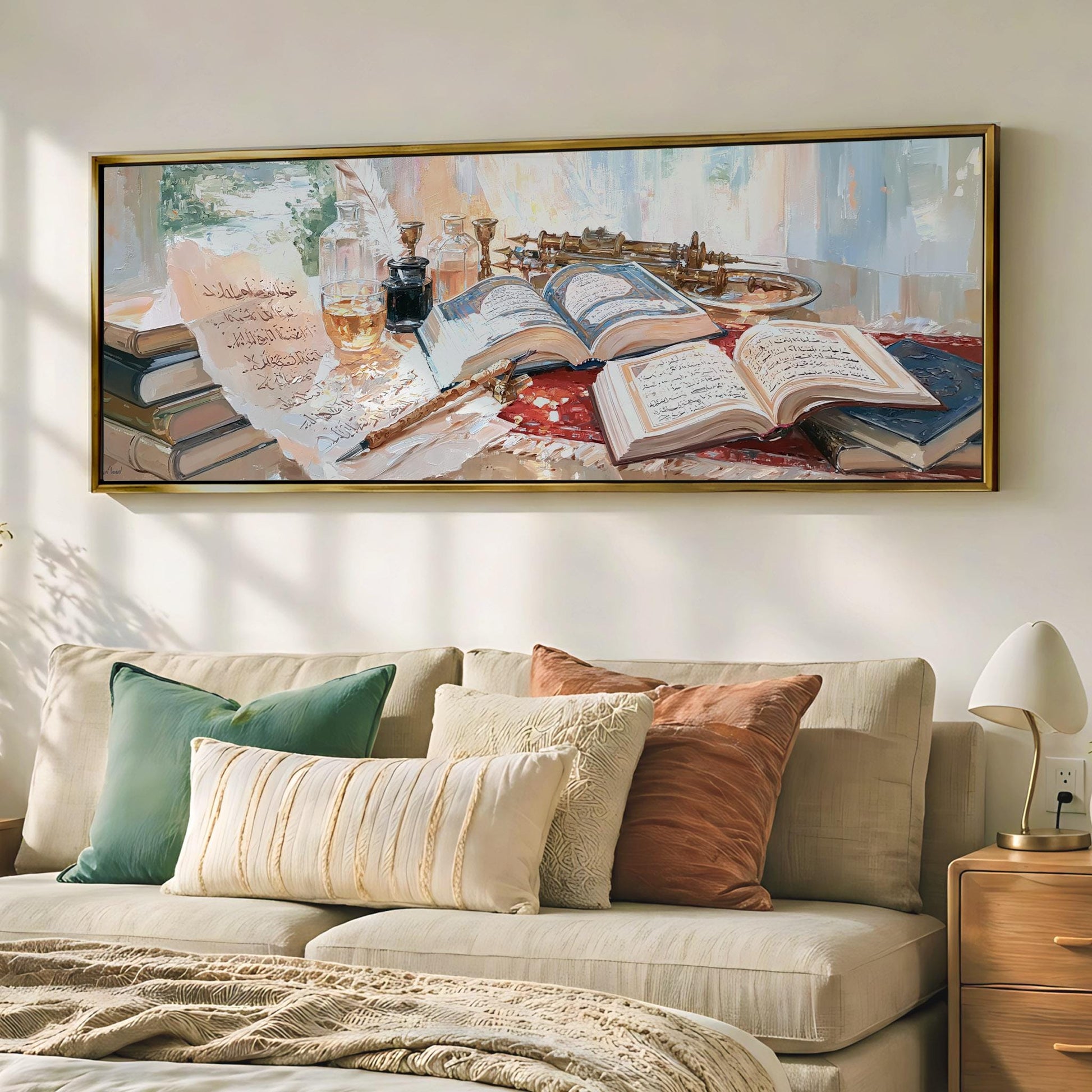 a cozy living room with a large framed painting of a table with books, a lamp, and other decorative items hanging on the wall above a beige sofa.
