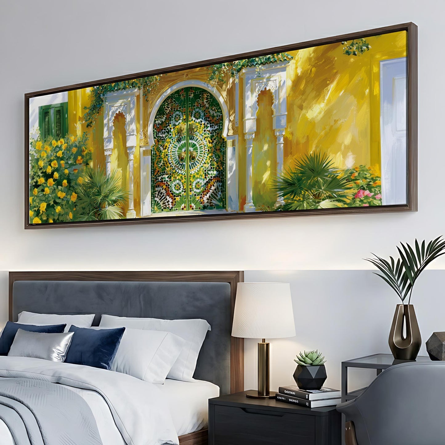 a large, colorful painting of a building with a green door and yellow walls, hanging on a wall above a bed with white linens and blue pillows.