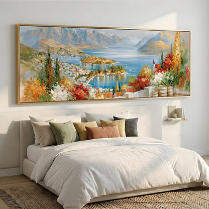 a large, colorful painting of a scenic landscape hanging on a wall above a bed with white bedding.