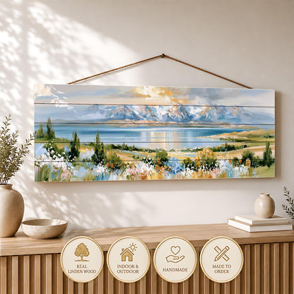 a large painting of a scenic landscape hanging on a wall, with a wooden shelf below it displaying decorative items.