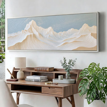 a wooden desk with a lamp, books, and a plant, set against a backdrop of a large landscape painting depicting a mountain range.
