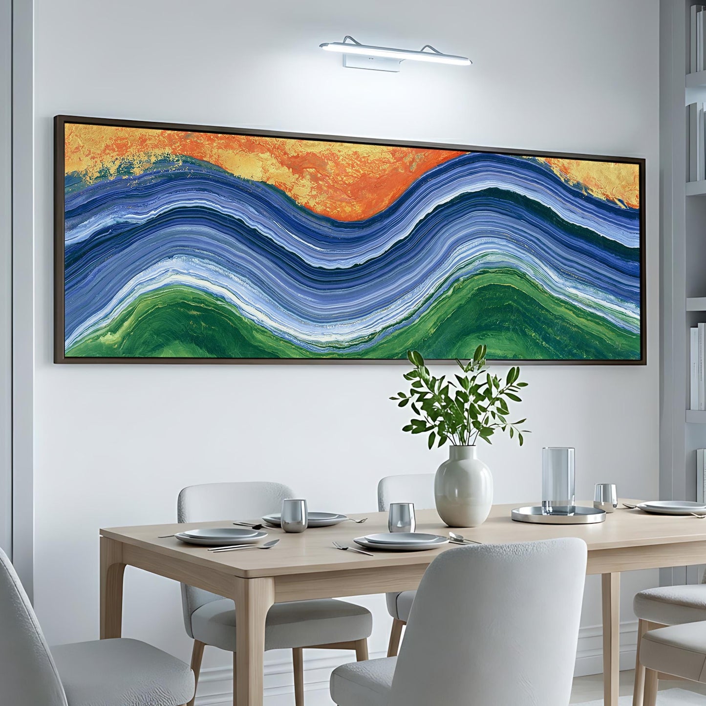 a dining room with a large, colorful abstract painting hanging on the wall above a wooden table set with plates, silverware, and a vase of flowers.