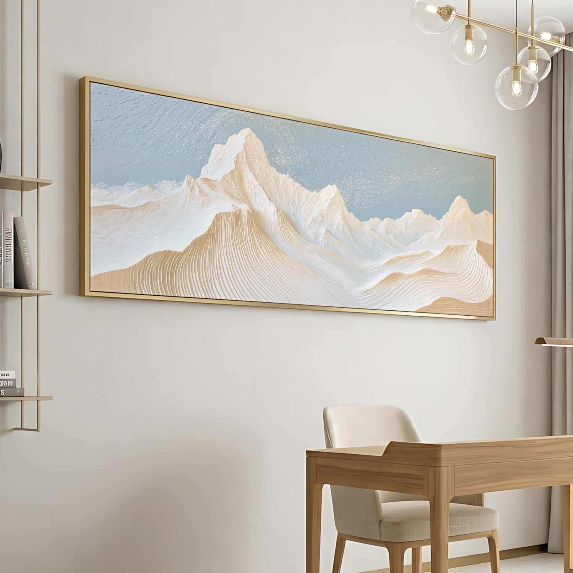 a large, framed painting of a mountain landscape hanging on a wall. Below the painting, there is a wooden desk with a chair, suggesting a workspace or study area.
