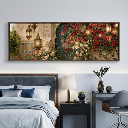 a bedroom with a large framed picture of a garden hanging on the wall above a bed. The picture depicts a lush garden with red flowers and greenery, creating a serene and inviting atmosphere.